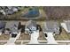 A lovely aerial view of neighborhood, highlighting landscaping and pond at 15925 Cobbs Crk Ln, Noblesville, IN 46060