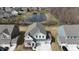 An aerial view of homes in the neighborhood surrounding a pond at 15925 Cobbs Crk Ln, Noblesville, IN 46060