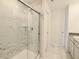 Modern bathroom featuring a tiled shower with glass door and sleek fixtures at 15925 Cobbs Crk Ln, Noblesville, IN 46060