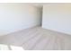 Spacious bedroom with neutral carpet, bright white walls, and natural light at 15925 Cobbs Crk Ln, Noblesville, IN 46060