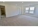 Spacious bedroom with natural light, plush carpeting, and two large windows with great outdoor views at 15925 Cobbs Crk Ln, Noblesville, IN 46060