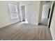 Bedroom featuring carpet flooring, a sliding door closet, and natural light from the window at 15925 Cobbs Crk Ln, Noblesville, IN 46060