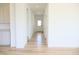 Hallway view with luxury vinyl plank floors and ample natural light at 15925 Cobbs Crk Ln, Noblesville, IN 46060