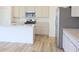 Modern kitchen with stainless steel appliances, island, and tile backsplash at 15925 Cobbs Crk Ln, Noblesville, IN 46060