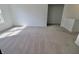 Bright living room with plush carpeting and ample natural light, creating a welcoming space at 15925 Cobbs Crk Ln, Noblesville, IN 46060