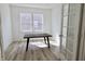 Bright office space featuring wood floors, two windows, and a simple wooden desk at 15925 Cobbs Crk Ln, Noblesville, IN 46060