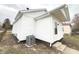 Back exterior angle featuring new siding and yard at 1640 W 7Th St, Anderson, IN 46016