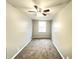 Neutral bedroom with a ceiling fan, window, and carpeted floor at 1640 W 7Th St, Anderson, IN 46016