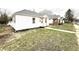 A cozy home featuring vinyl siding and a well-maintained lawn at 1640 W 7Th St, Anderson, IN 46016