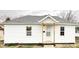 Charming single-story home with a fresh white exterior and inviting front porch at 1640 W 7Th St, Anderson, IN 46016
