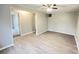 An empty room featuring light gray walls and modern wood-look flooring at 1640 W 7Th St, Anderson, IN 46016