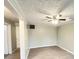 Spacious room with modern vinyl flooring, ceiling fan, and neutral paint at 1640 W 7Th St, Anderson, IN 46016