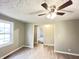 Inviting living room with modern flooring, neutral paint, and ample natural light at 1640 W 7Th St, Anderson, IN 46016