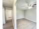 Light-filled open floorplan featuring modern vinyl plank flooring and neutral walls at 1640 W 7Th St, Anderson, IN 46016