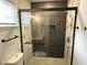 Beautiful bathroom with a glass shower, golden hardware and elegant finishes at 1716 E Kelly St, Indianapolis, IN 46203