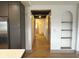 Hallway leading from the kitchen with modern lighting and archway shelving at 1716 E Kelly St, Indianapolis, IN 46203