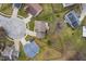 Aerial view of the home with a circular driveway, mature trees and neighboring homes at 17918 Lucas Cir, Westfield, IN 46074