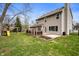 Backyard featuring a swing set, lawn, patio and deck areas with a view of the home at 17918 Lucas Cir, Westfield, IN 46074