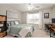 Cozy bedroom with comfortable bed, natural light, and a dedicated workspace at 17918 Lucas Cir, Westfield, IN 46074