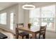 Cozy breakfast nook featuring a wooden table, bright windows, and access to the outdoors at 17918 Lucas Cir, Westfield, IN 46074