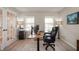 Well-lit home office featuring a large desk, comfortable chair, and ample storage at 17918 Lucas Cir, Westfield, IN 46074
