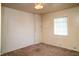 Cozy bedroom with a ceiling light and a window providing natural light at 1821 E Stop 10 Rd, Indianapolis, IN 46227