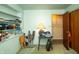A spare room with an open closet, a lamp on a desk, and carpeted flooring at 1821 E Stop 10 Rd, Indianapolis, IN 46227