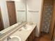 Functional bathroom featuring a double sink vanity, a large mirror, and a convenient shower stall at 1835 Carpenter Cir, Indianapolis, IN 46203