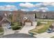 Aerial view of a two-story brick and siding house on a corner lot with a two-car garage at 18358 Benton Oak Dr, Noblesville, IN 46062
