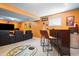 Finished basement with a wet bar, comfortable seating, and a large entertainment area at 18358 Benton Oak Dr, Noblesville, IN 46062