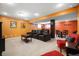 Cozy basement featuring comfortable seating, a dark accent wall and a table for entertaining at 18358 Benton Oak Dr, Noblesville, IN 46062