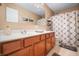 Large bathroom vanity featuring double sinks, ample storage, and a well-lit mirror at 18358 Benton Oak Dr, Noblesville, IN 46062