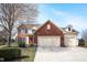 Charming two-story home featuring a brick facade, attached two-car garage, and well-manicured lawn at 18358 Benton Oak Dr, Noblesville, IN 46062