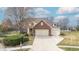 Aerial shot of a two-story home with brick and siding, a two-car garage, and a large driveway at 18358 Benton Oak Dr, Noblesville, IN 46062