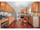 Spacious kitchen with stainless steel appliances, granite countertops, and hardwood floor at 18358 Benton Oak Dr, Noblesville, IN 46062
