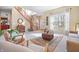 Inviting living room featuring a staircase, large windows, and stylish decor creating an open and airy space at 18358 Benton Oak Dr, Noblesville, IN 46062
