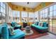 Inviting sunroom with cozy seating, bright decor, and plenty of natural light at 18358 Benton Oak Dr, Noblesville, IN 46062