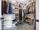Spacious walk-in closet providing ample shelving and hanging space for clothing and accessories at 18358 Benton Oak Dr, Noblesville, IN 46062