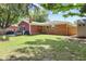 Spacious backyard with grass, a firepit, patio, and an outdoor shed at 1906 E Markwood Ave, Indianapolis, IN 46227