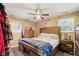 Bedroom featuring wooden furniture, including a bed, dresser, and nightstand at 1906 E Markwood Ave, Indianapolis, IN 46227