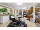 Bright eat-in kitchen featuring a round dining table, modern appliances, and views to the adjacent kitchen at 1906 E Markwood Ave, Indianapolis, IN 46227