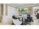 Inviting dining area features a modern round table, stylish chairs, and a window with natural light at 1906 E Markwood Ave, Indianapolis, IN 46227