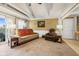 Cozy living room with neutral-toned carpet, comfortable seating, and a decorative ceiling fan at 1906 E Markwood Ave, Indianapolis, IN 46227