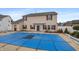 The backyard features a covered in-ground pool and views of the home's rear exterior at 1975 Westminster Pl, Columbus, IN 47201
