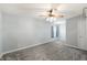 A bedroom with carpet, ceiling fan, and natural light creates a cozy retreat at 1975 Westminster Pl, Columbus, IN 47201