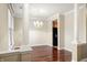 Open dining room with hardwood floors, modern lighting, and decorative columns, perfect for entertaining guests at 1975 Westminster Pl, Columbus, IN 47201