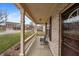 Inviting covered front porch with decorative columns offering a cozy outdoor seating area and neighborhood views at 1975 Westminster Pl, Columbus, IN 47201
