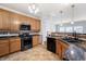 Kitchen with granite countertops and a view to an adjacent living space at 1975 Westminster Pl, Columbus, IN 47201