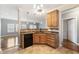 Cozy kitchen with light-colored wood cabinets and black appliances at 1975 Westminster Pl, Columbus, IN 47201