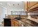 Spacious kitchen features granite countertops and stainless steel dishwasher at 1975 Westminster Pl, Columbus, IN 47201